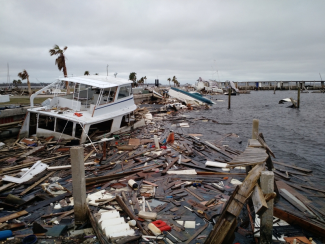 Marine debris, such as a sunken vessel and floating lumber, were created after Hurricane Michael.