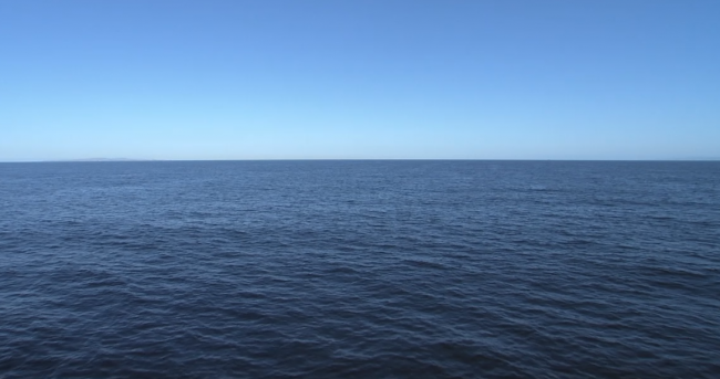 An image of the open ocean with only water and sky visible.