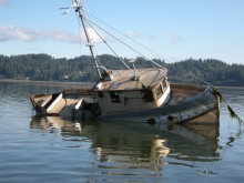 A vessel tilted to its side and flooded.