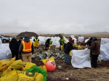 Marine debris removal team members sort collected debris. 