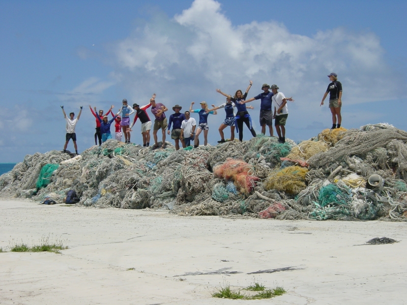 A cleanup crew celebrates the collection of derelict nets in the Northwestern Hawaiian Islands. 