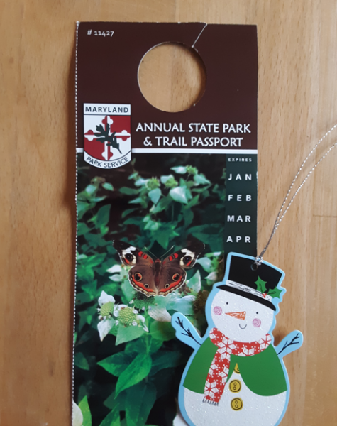 An annual state park and trail passport wrapped with a recycled Christmas tag.