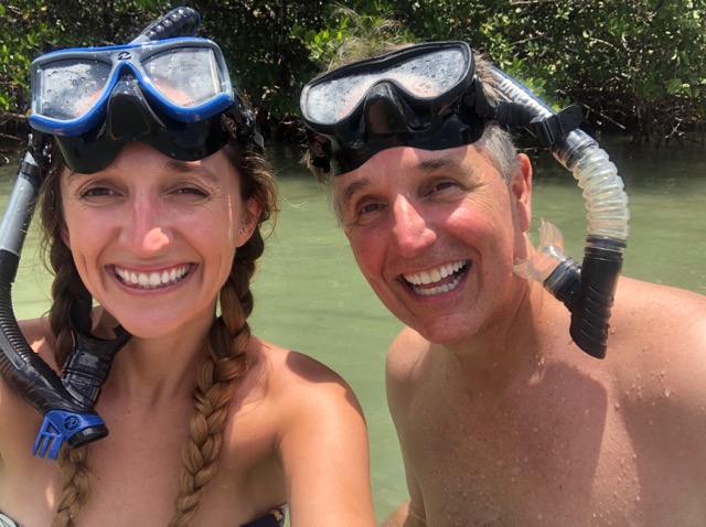 Daughter and father snorkel in South Florida. 
