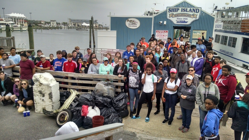 A group of students on a pier.