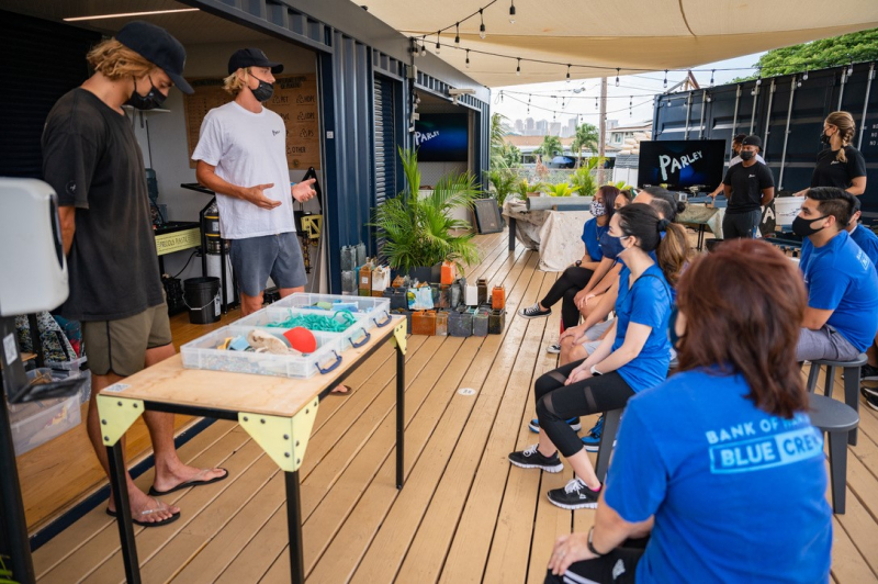 Marine debris educators meet with a group at the Parley AIR Station.