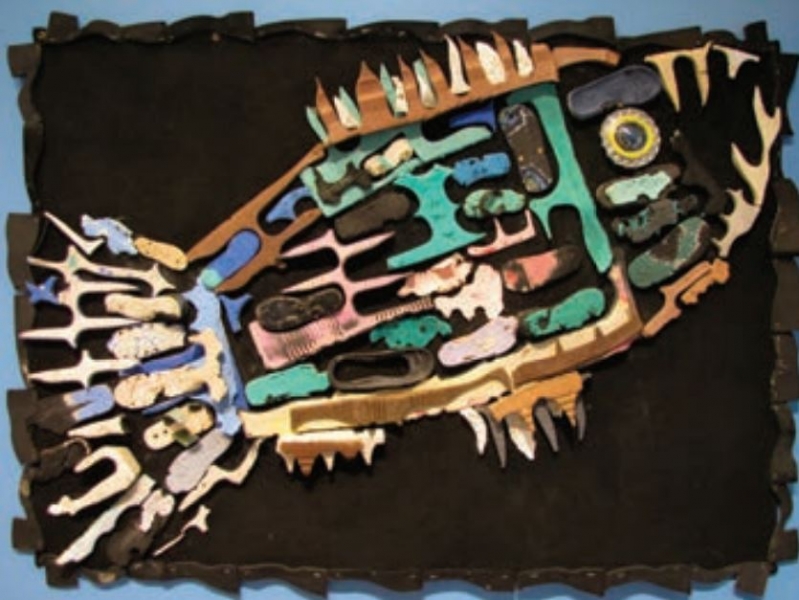 An image of a fish created by using different colors of marine debris plastic. 