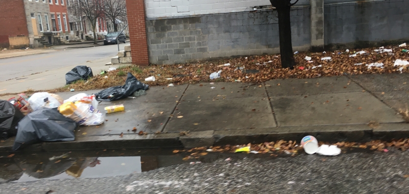 Trash on a sidewalk.