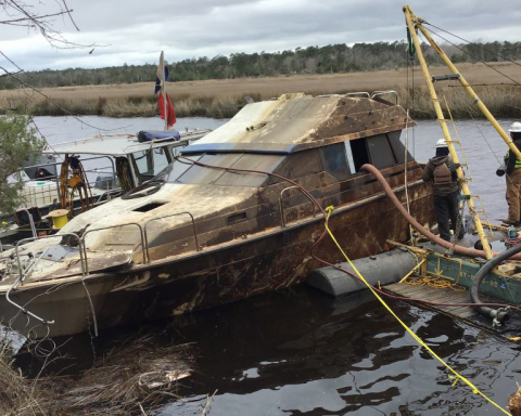 Contractors working to remove an abandoned and derelict vessel.