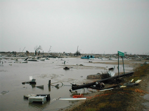A flooded, flat area with lots of debris.
