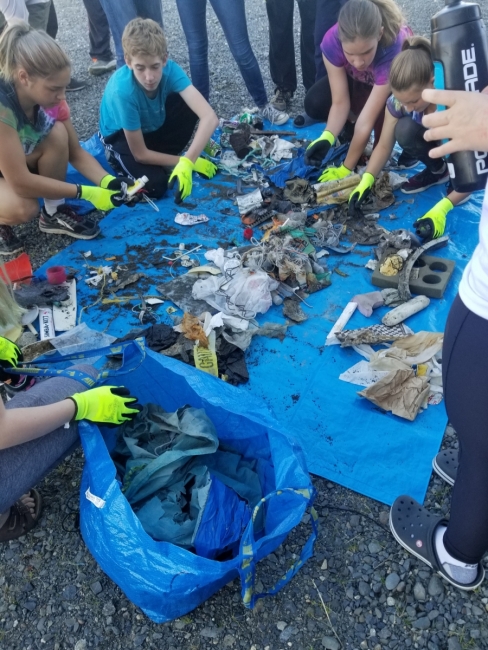 Students sort marine debris. 