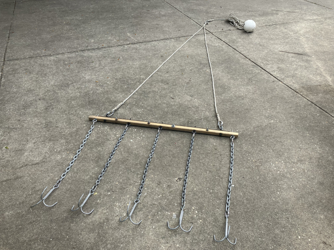 A custom grappling device used to snag derelict crab traps underwater.