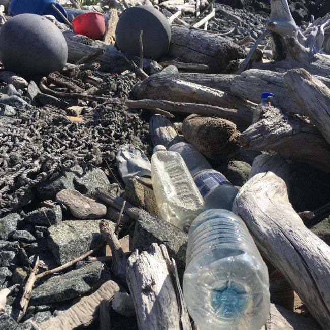 Buoys and plastic bottles litter the Alaska Peninsula shoreline.