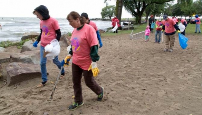 Volunteers cleaning up a beach.