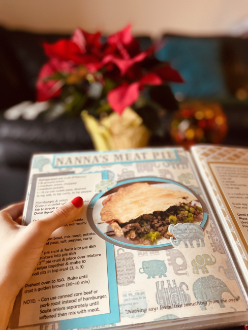 A handmade recipe book opened to “Nanna’s Meat Pie” recipe.