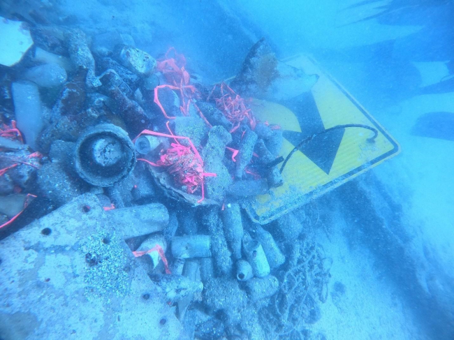 A pile of marine debris at an underwater staging site. 