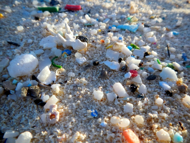 Pieces of microplastic on a beach.