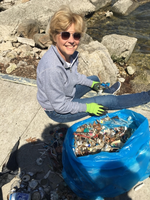 Shoreline cleanup volunteer. 