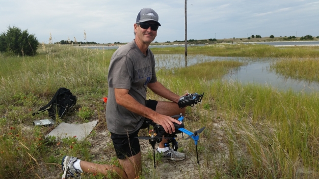 A Duke researcher prepares the UAS for a flight over the Rachel Carson Reserve to assess habitat regeneration from areas where medium and large debris items were removed.