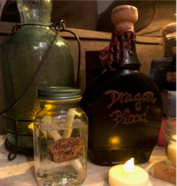 Repurposed glass containers used to create Halloween decorations.