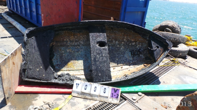 A retrieved derelict boat from the former anchorage site.