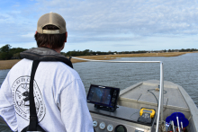 A South biologist uses side-scan sonar to identify derelict traps.