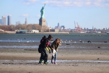 Kids cleaning up a NYC beach.
