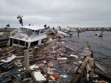 Marine debris, such as a sunken vessel and floating lumber, were created after Hurricane Michael.