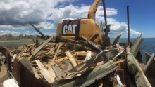 An excavator removes dock debris following Hurricane Florence. 