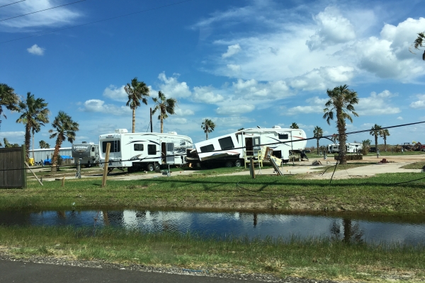 Damage to two mobile homes following a storm. 